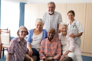 group of smiling residents at assisted living in Florida