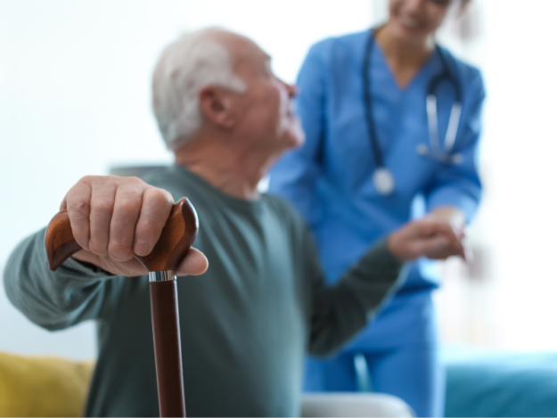 Senior being assisted