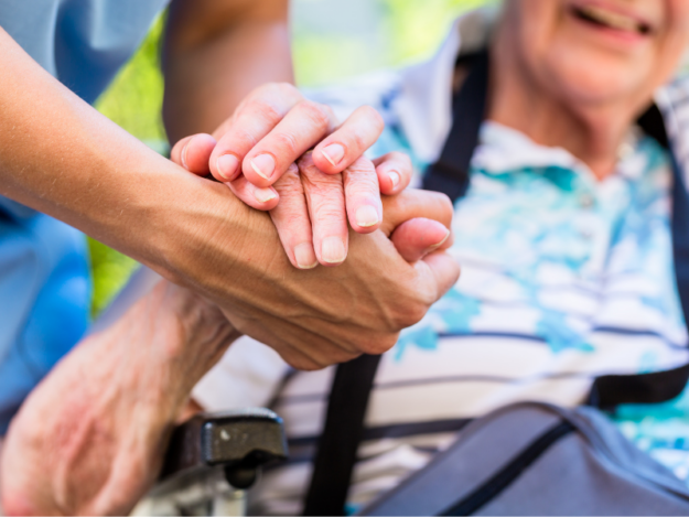holding a Senior's hand