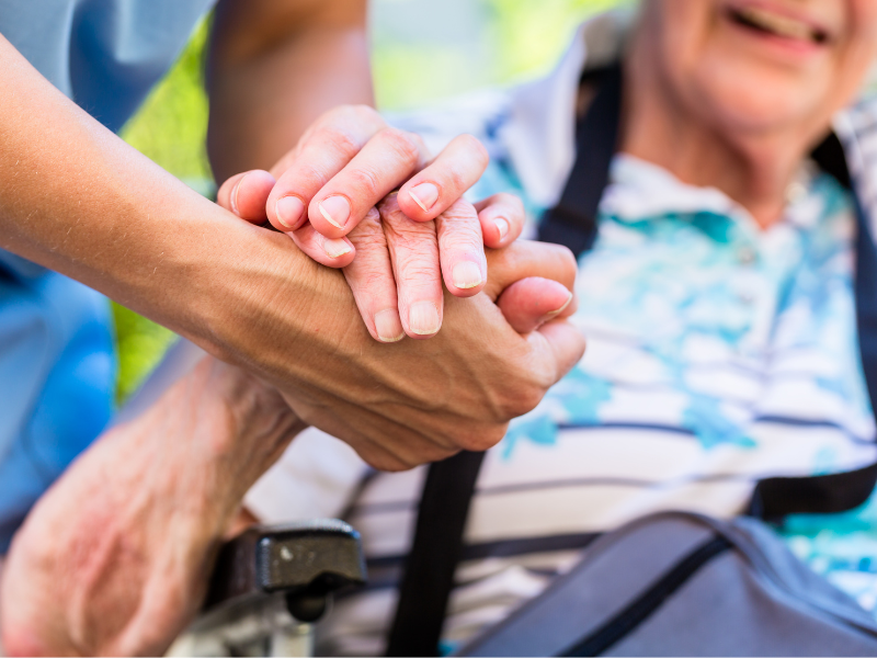 holding a Senior's hand