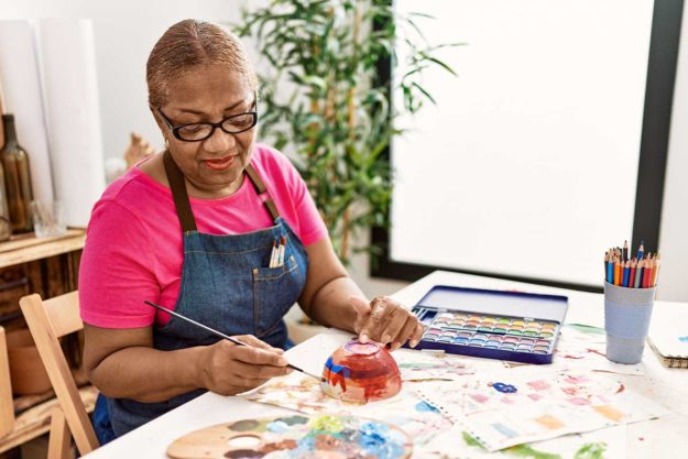 5 Arts and Crafts Ideas for Seniors person considering arts and crafts ideas