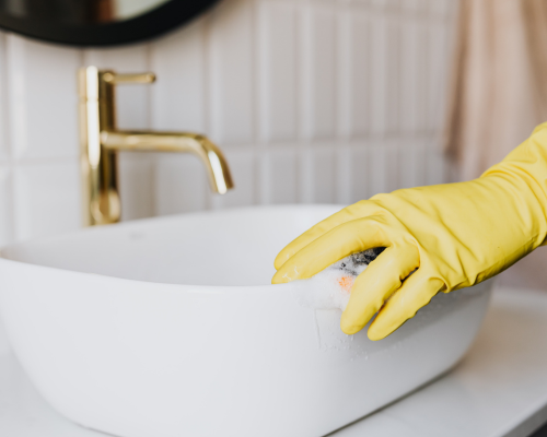 Summer’s Landing (27) cleaning a white ceramic sink