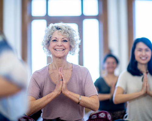 Senior citizen doing a yoga class