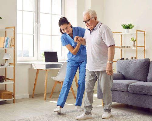 Senior citizen in assisted living facility recieving assistance from a staff member