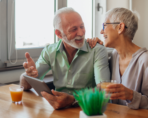 older couple smiling and talking to each other