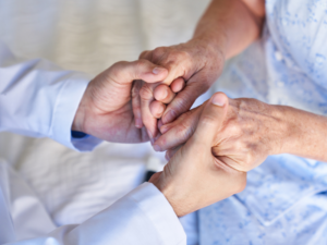care worker holding Senior citzen's hands